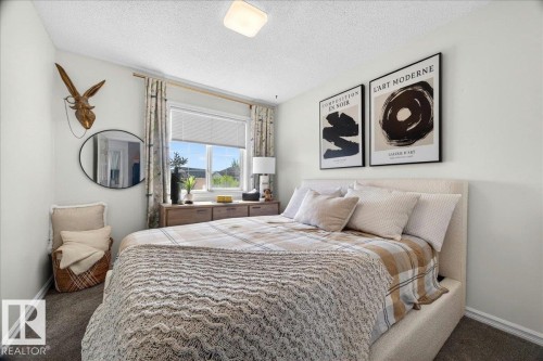 Bedroom featuring light wall color, carpet flooring, a window with blinds, and recessed lighting - 3934 160 Avenue, Edmonton, AB 