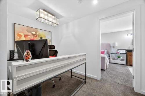 Dedicated office space featuring white walls, recessed lighting, and a modern rectangular ceiling light fixture - 3934 160 Avenue, Edmonton, AB 