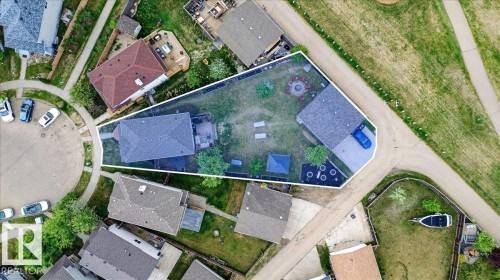 Aerial perspective showcasing a property with a spacious backyard and direct access to a paved trail - 3934 160 Avenue, Edmonton, AB 
