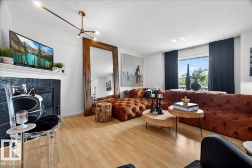 Spacious living area featuring light wood-finish flooring and a white ceiling - 3934 160 Avenue, Edmonton, AB 