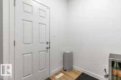 White six-panel interior door with brushed nickel hardware - 