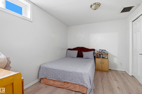 Room with light wood-finish flooring and white baseboards - 8911 169 Street Nw, Edmonton, AB 