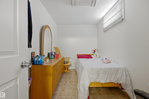Compact room featuring white walls and neutral-toned tile flooring - 8911 169 Street Nw, Edmonton, AB 
