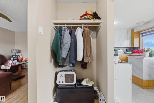 Recessed entry closet with upper shelving and hanging rod - 8911 169 Street Nw, Edmonton, AB 