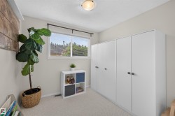 Recessed window with blinds, light wall paint, textured ceiling, flush mount ceiling light, and wall-to-wall carpeting - 