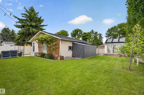 Expansive green lawn with established trees and foliage - 244 Knottwood Road N, Edmonton, AB 