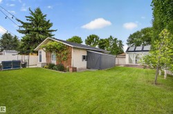 Expansive green lawn with established trees and foliage - 