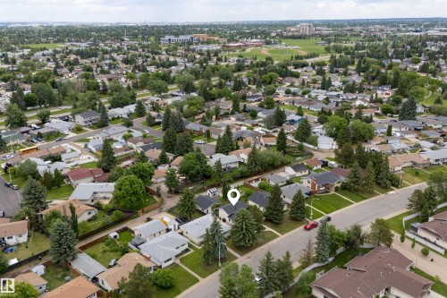 Aerial perspective showcasing a residential neighborhood with established homes and mature trees - 244 Knottwood Road N, Edmonton, AB 
