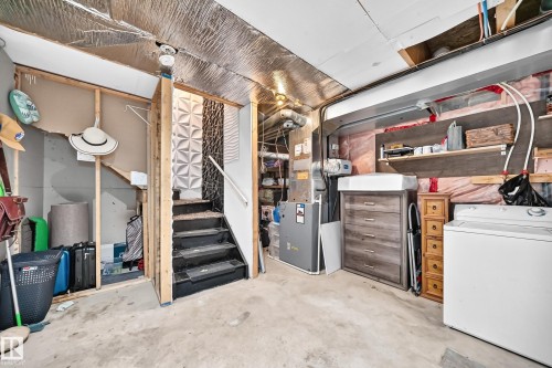 Concrete floor basement with exposed ceiling joists and foil insulation - 146 5604 199 Street, Edmonton, AB 