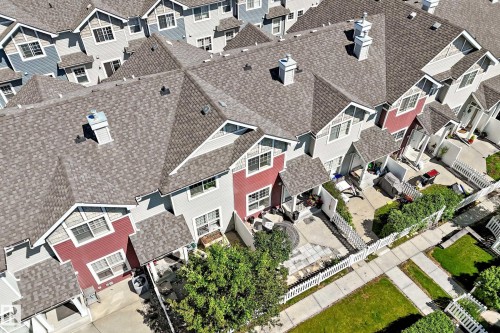 Contemporary townhome-style residences featuring pitched shingle roofing and varied exterior finishes - 146 5604 199 Street, Edmonton, AB 