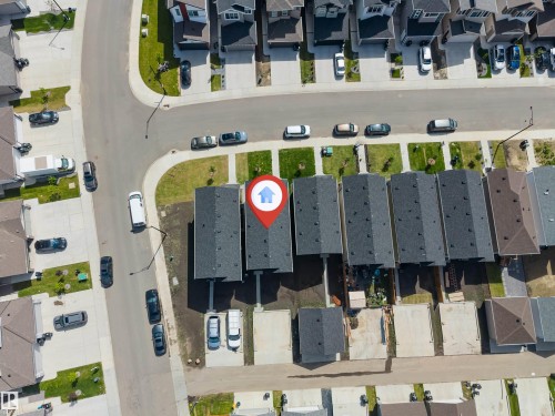 Aerial perspective highlighting a residential property within a structured neighborhood - 1208 14 Ave Nw, Edmonton, AB 