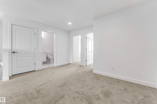 Neutral-toned carpeting throughout - 1208 14 Ave Nw, Edmonton, AB 
