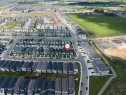 Aerial view showcasing a residential development with structured street layouts and consistent house designs - 1208 14 Ave Nw, Edmonton, AB 