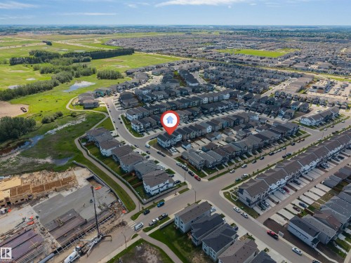 Aerial perspective of a developed residential area with uniform housing structures - 1208 14 Ave Nw, Edmonton, AB 