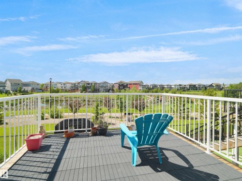Outdoor deck with composite decking and white railings - 4615 175 Avenue, Edmonton, AB 