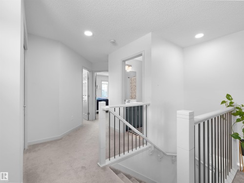 Upper level hallway featuring plush carpeting and recessed lighting - 4615 175 Avenue, Edmonton, AB 