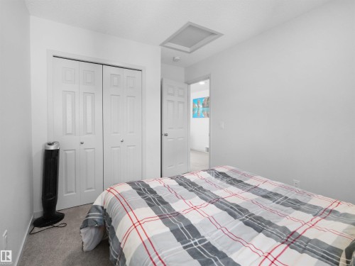 Room featuring neutral wall finishes and gray carpet flooring - 4615 175 Avenue, Edmonton, AB 