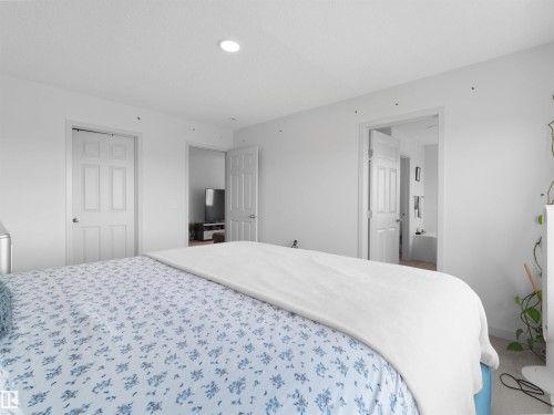 White walls with recessed ceiling lighting - 4615 175 Avenue, Edmonton, AB 