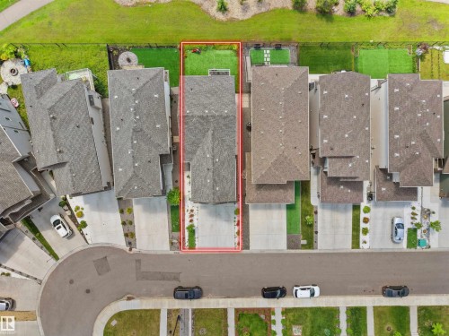 Townhome with an asphalt shingle roof and a concrete driveway - 4615 175 Avenue, Edmonton, AB 