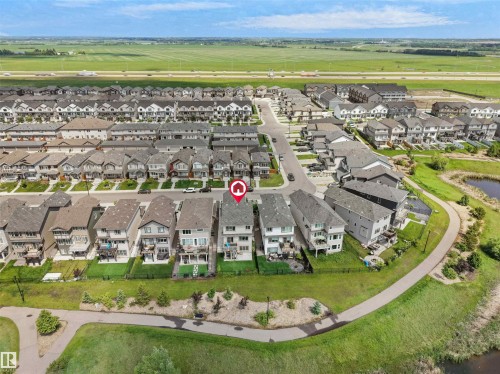 Aerial perspective showcasing a residential community with multi-story homes - 4615 175 Avenue, Edmonton, AB 