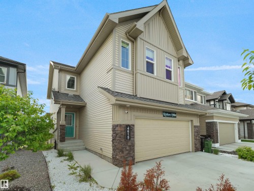 Contemporary two-story exterior featuring tan siding and stone accents - 4615 175 Avenue, Edmonton, AB 