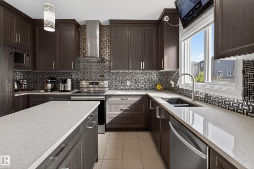 8607 Mayday Wynd, Edmonton, AB - Indoor Photo Showing Kitchen With Stainless Steel Kitchen With Double Sink With Upgraded Kitchen