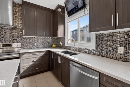 8607 Mayday Wynd, Edmonton, AB - Indoor Photo Showing Kitchen With Stainless Steel Kitchen With Double Sink With Upgraded Kitchen