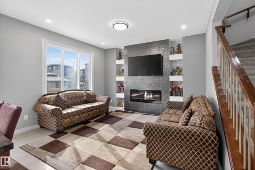 8607 Mayday Wynd, Edmonton, AB - Indoor Photo Showing Living Room With Fireplace