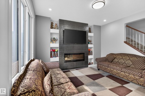 8607 Mayday Wynd, Edmonton, AB - Indoor Photo Showing Living Room With Fireplace