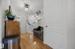 Wood-finish flooring throughout the entryway - 