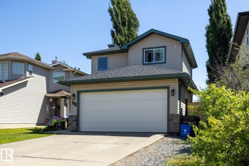 Siding exterior with complementary trim, attached garage, and concrete driveway - 60 Leyland Way, Spruce Grove, AB 