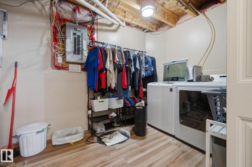 Dedicated laundry area with durable wood-finish flooring - 60 Leyland Way, Spruce Grove, AB 