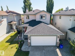Contemporary residence with a two-car garage, concrete driveway, and contrasting trim - 
