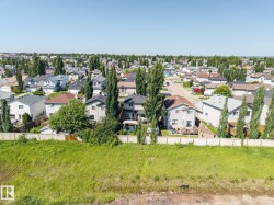 Residential neighborhood featuring varied architectural styles and mature trees - 