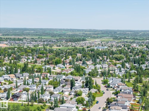 Expansive aerial perspective showcasing a residential neighborhood with numerous homes - 60 Leyland Way, Spruce Grove, AB 