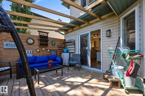 Wooden deck area featuring a slatted privacy fence - 60 Leyland Way, Spruce Grove, AB 