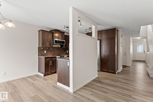 Open concept living space featuring light wood-finish flooring - 12523 171 Avenue, Edmonton, AB 