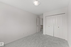 Room featuring light gray carpeting and white walls - 
