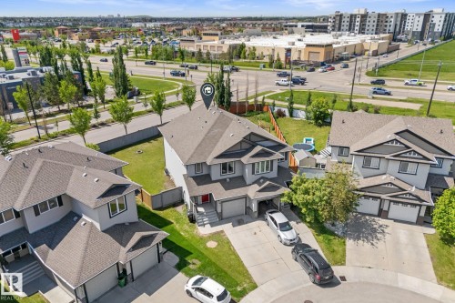 Contemporary two-story residence featuring a neutral grey exterior and dark trim accents - 12523 171 Avenue, Edmonton, AB 
