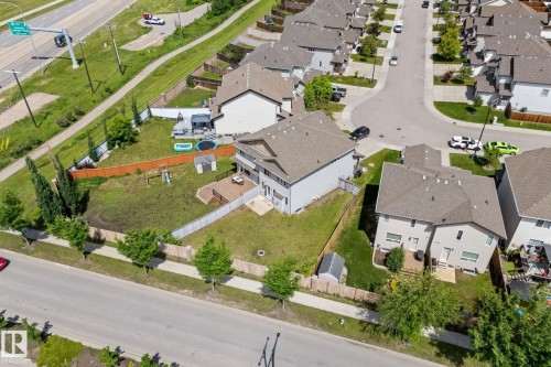 Expansive backyard featuring a partial wood fence, partial chain-link fence, and a small storage shed - 12523 171 Avenue, Edmonton, AB 
