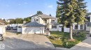 Exterior featuring light-colored stucco, a multi-car driveway, a two-car attached garage, and a separate single-car attached garage - 4615 43A Avenue, Edmonton, AB  - Outdoor 