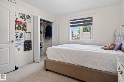 Bedroom featuring neutral-toned carpeting and light-colored walls - 4615 43A Avenue, Edmonton, AB - Indoor Photo Showing Bedroom