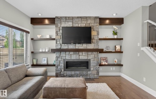 3411 Abbott Way, Edmonton, AB - Indoor Photo Showing Living Room With Fireplace