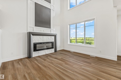 178 Elliott Wynd, Fort Saskatchewan, AB - Indoor Photo Showing Living Room With Fireplace