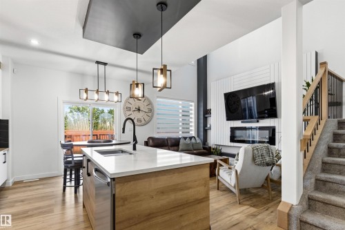 Open-concept living space with wood-finish flooring - 7 Tenor Link, Spruce Grove, AB 