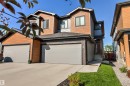 Contemporary multi-level residence featuring contrasting wood-look and grey siding - 7 Tenor Link, Spruce Grove, AB 