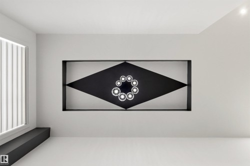 Modern interior featuring a recessed wall art installation with circular accent lighting - 7 Tenor Link, Spruce Grove, AB 