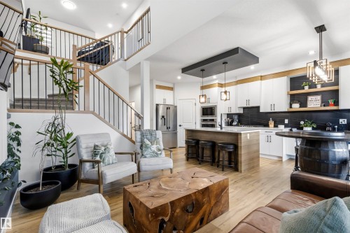 Open-concept living area with wood-finish flooring - 7 Tenor Link, Spruce Grove, AB 