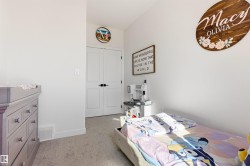 White-painted walls and light gray carpet throughout - 