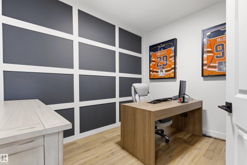 Accent wall featuring a geometric grid design - 7 Tenor Link, Spruce Grove, AB 